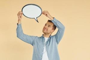 Ideas in the mind. Man standing in the studio with empty signs for the text photo