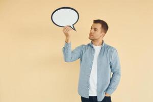 Ideas in the mind. Man standing in the studio with empty signs for the text photo