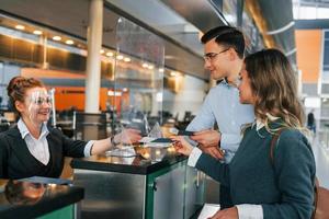 Professional service. Young couple is in the airport together photo