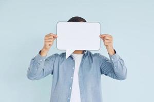 In casual clothes. Man standing in the studio with empty signs for the text photo