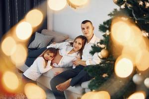 Happy family celebrating holidays indoors together photo