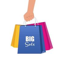 Hand with multicolored shopping bags. Big sale concept vector Illustration.