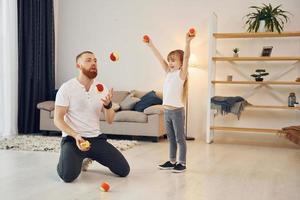 Father with his little daughter is at home together photo