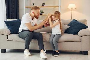 Father with his little daughter is at home together photo