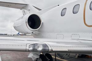 Close up view. Turboprop aircraft parked on the runway at daytime photo