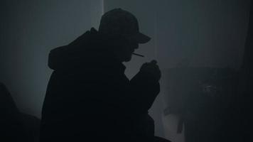 Silhouette Of Man Lighting And Smoking A Cigarette video