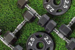 Dumbbells and weights on the grass photo