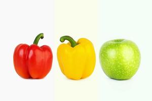 big red and yellow peppers and big green apple photo