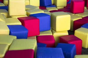 Kids playground with soft multi-colored cubes photo