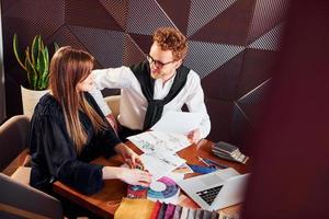 Business people working with documents. Indoors of new modern luxury restaurant photo