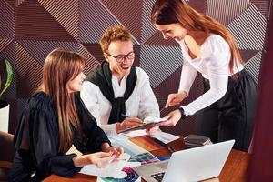 Business people working with documents. Indoors of new modern luxury restaurant photo