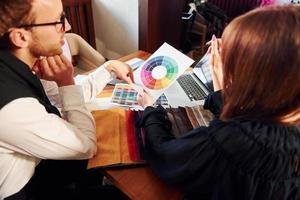 Business people working with documents. Indoors of new modern luxury restaurant photo