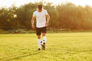 One person only. Young soccer player have training on the sportive field photo