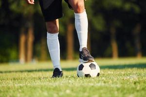 Young soccer player have training on the sportive field photo