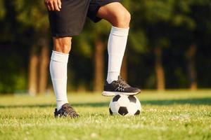 Young soccer player have training on the sportive field photo