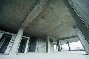 Indoors in the unfinished building. Conception of construction photo