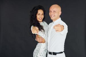 Embracing each other. Cheerful couple is together indoors photo