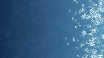 fondo de navidad azul con copos de nieve y partículas bokeh video