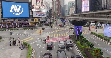 timelapse video illuminated of the street road in the city business downtown financial famous district area with some traffic in KL,modern city downtown  district timelapse background