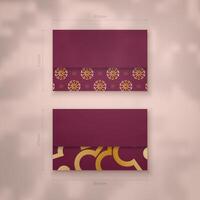 Two purple and gold envelopes with floral patterns vector