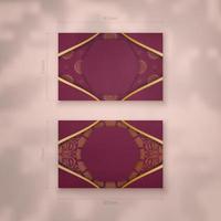 Burgundy business card with Indian gold ornaments for your business. vector