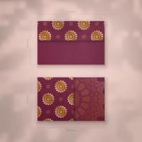 Burgundy business card with vintage gold ornaments for your business. vector