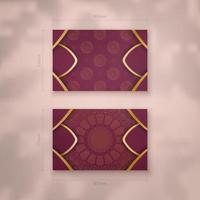 Burgundy business card with Indian gold pattern for your brand. vector