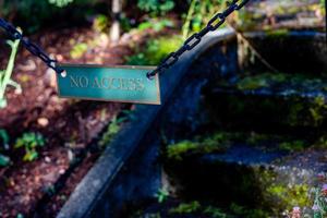 No access sign on moss covered concrete stairs photo