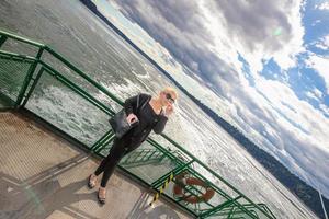 Pretty woman standing on the deck photo