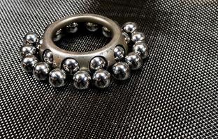 Ball bearings and wheel bearing on carbon fiber cloth photo