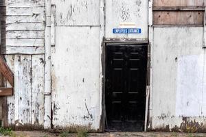 No trespassing employees only sign on an old building photo