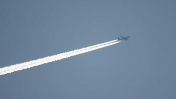 Widebody airplane flying at high altitude with contrail video