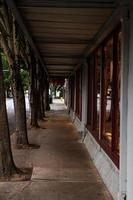 Empty retail storefront covered sidewalk photo