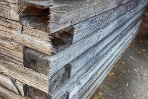 Abstract stacked wood wall corner photo