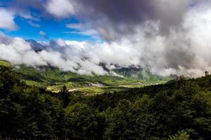 Mt. St. Helens area foggy cloudy forest valley with river photo