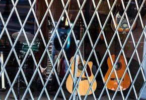 Pawn shop window covered by bars photo