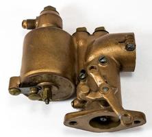 Antique automotive brass updraft carburetor photo
