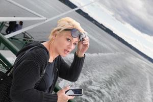 Pretty blonde tourist on a ferry photo