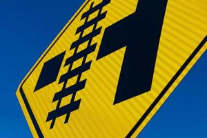 Abstract Railroad crossing sign at angle photo