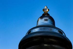 Glass street lamp head close up photo