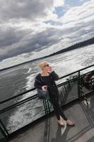 Pretty blonde tourist on a ferry photo