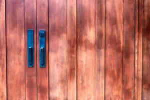 Antique building double doors with faded paint photo