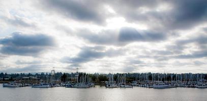 Cloudy marina with sun rays photo