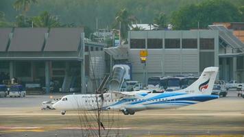 PHUKET, THAILAND DECEMBER 2, 2016 - Bangkok Airways ATR 72 600 HS PZF before take off from Phuket airport. View from the top floor of the hotel Centara Grand West Sands Resort Phuket video