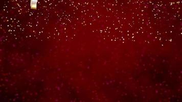 Reflective gold Christmas tree, star and light bulb ornaments hanging and gently rotating with snow particles falling against red defocused background. 3d animation video