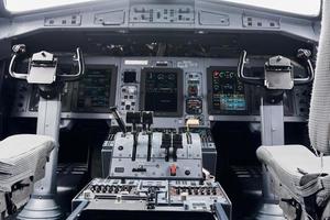 Knobs and buttons. Close up focused view of airplane cockpit photo