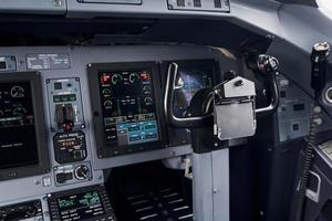 Knobs and buttons. Close up focused view of airplane cockpit photo