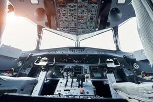 Beautiful sunlight. Close up focused view of airplane cockpit photo