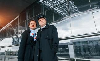 Man with woman. Aircraft crew in work uniform is together outdoors in the airport photo