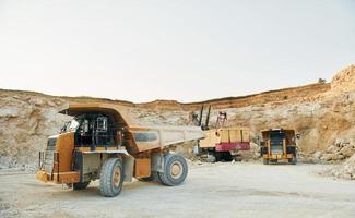 Loading vehicle is outdoors on the borrow pit at daytime photo